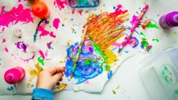 Children painting items for a school fundariser